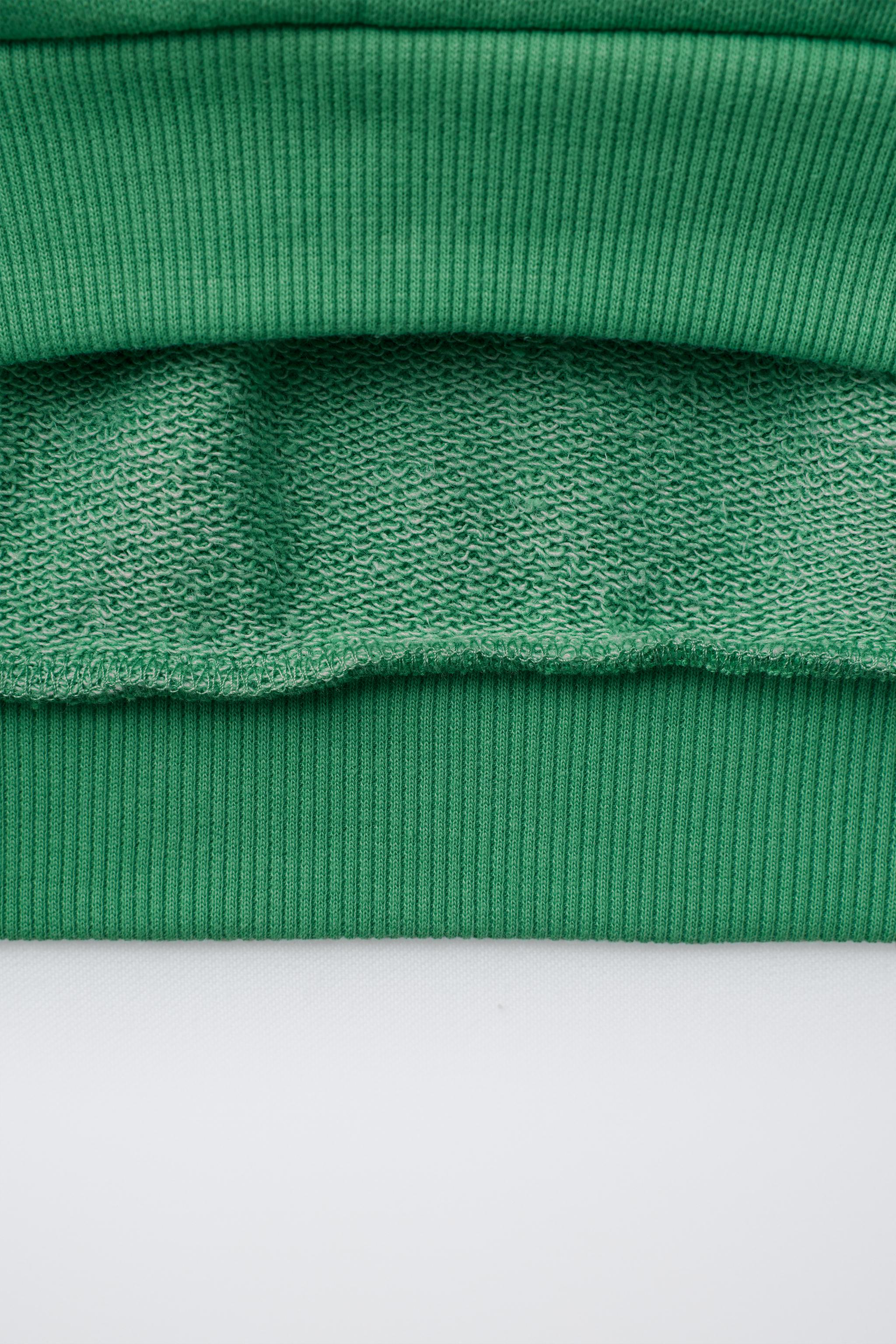 SWEAT À INSCRIPTION ET BANDES EN CONTRASTE